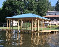 Double slip dock (stationery) with hip roof system with blue metal roofing