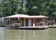 Single slip dock stationery with covered slip and covered seating area on Lake Sinclair