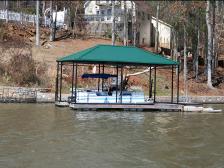 Single slip floating dock Lake Jackson, steel frame with hip roof and composite flooring